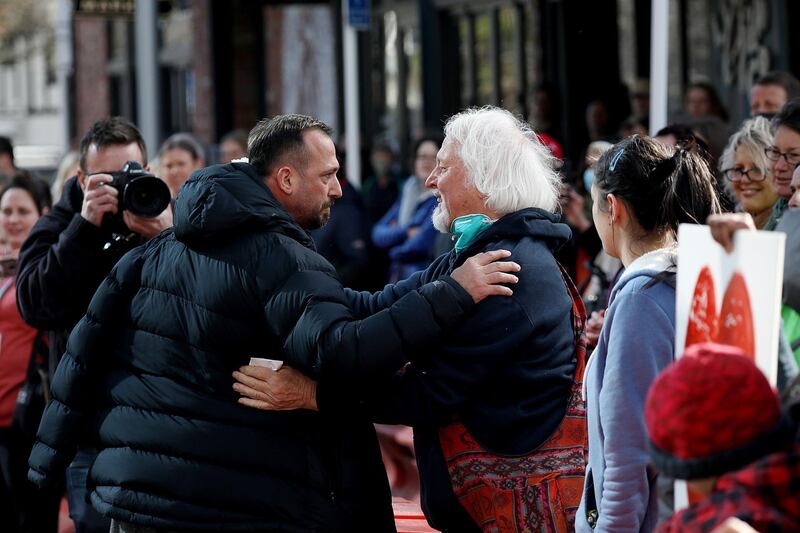 Temel Atacocugu (L), a survivor of the twin mosque shootings, thanks members of the public outside the High Court after the conclusion of the sentencing hearing for Australian white supremacist Brenton Tarrant in Christchurch. AFP