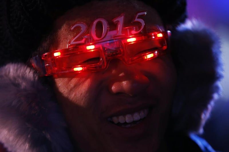 A man wears a pair of eyewear in the shape of the year 2015 as he waits for the countdown to 2015 in Beijing, China on December 31, 2014. Kim Kyung-Hoon/Reuters
