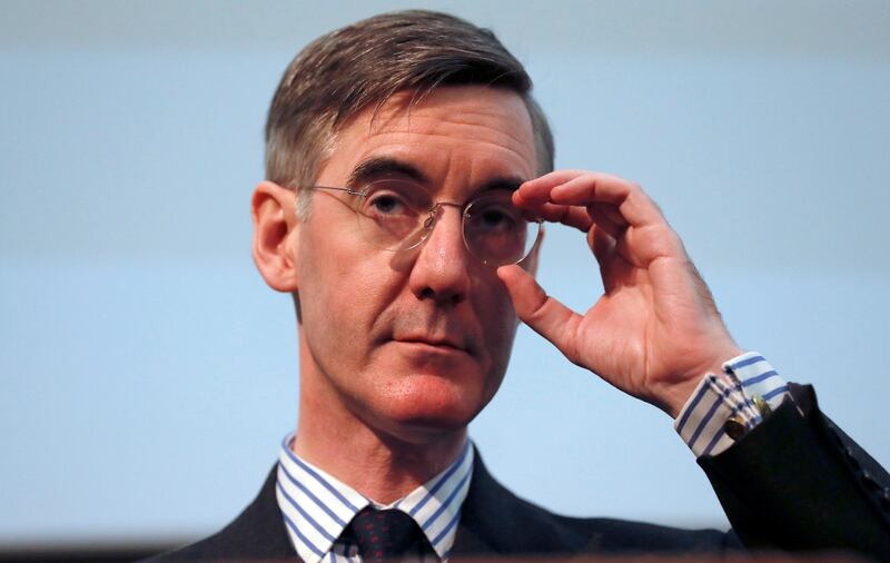FILE - In this Wednesday, Jan. 23, 2019 file photo, British lawmaker Jacob Rees-Mogg gestures as he speaks at a meeting for eurosceptic think tank The Bruges group, in London. The new leader of Britain��������s House of Commons has some old-fashioned rules for staff, banning metric measurements and ordering men to be addressed as �������esquire.������� A memo for staff of Conservative lawmaker Jacob Rees-Mogg published Friday, July 26 says men without aristocratic titles should get the suffix �������Esq.������� in correspondence. (AP Photo/Alastair Grant, file)