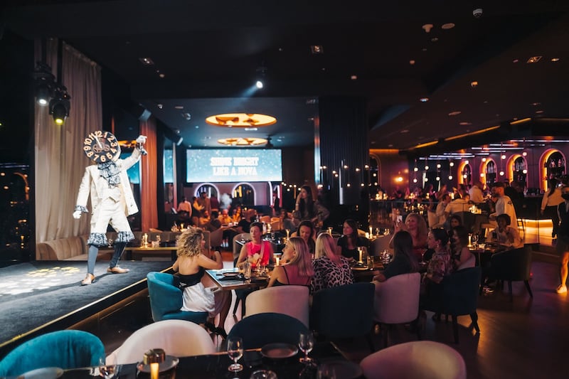 Nova at Address Dubai Marina has a central stage that features singers, musicians and aerialists. Photo: Nova Restaurant & Lounge