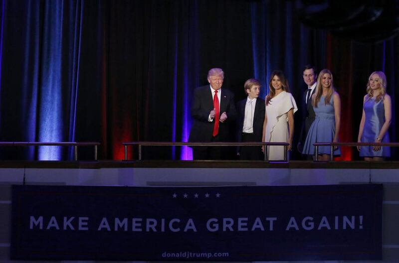 Republican US president-elect Donald Trump is accompanied by members of his family as he arrives to address supporters at his election night rally in Manhattan, New York. Brendan McDermid / Reuters