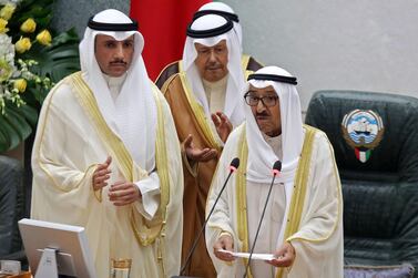 Kuwaiti Parliament Speaker Marzouq al-Ghani (L) listens to Kuwait's Emir Sheikh Sabah Al Ahmad Al-Sabah (C) as he addresses Gulf emirate's parliament during the opening of its new term at the National Assembly in Kuwait City, on October 29, 2019. AFP