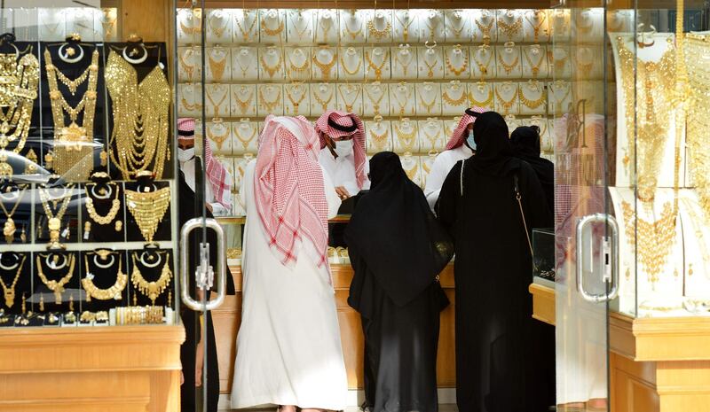 Saudis shop at a jewellery shop in the Tiba gold market in the capital Riyadh, after authorities announced a 10% increase in the VAT rate, to reach 15%, starting from July 1.   AFP