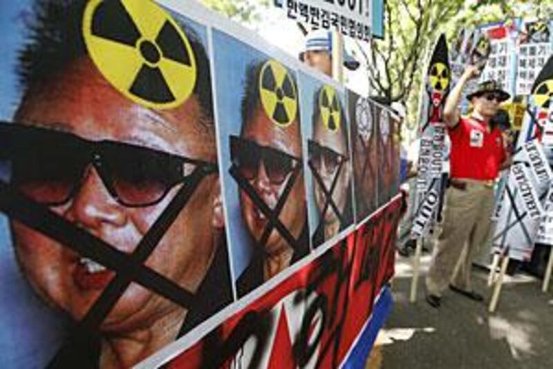 Anti-North Korea protesters chant slogans denouncing North Korea's nuclear programme at a rally in Seoul today.