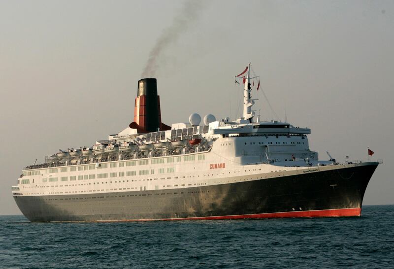 File - The ocean liner Queen Elizabeth 2 arrives in Dubai, United Arab Emirates, in this Wednesday, Nov. 26, 2008 file photo. The cash-strapped Dubai owner of the QE2 is weighing plans to open the British ocean liner as a floating hotel elsewhere in the Middle East or Africa rather than in the struggling Persian Gulf sheikdom. In an email Sunday July 12, 2009, ship owner Nakheel told The Associated Press that other ports have expressed interest in hosting the vessel and that it is evaluating those options before going ahead with a planned refurbishment. (AP Photo/Kamran Jebreili, FIle) *** Local Caption ***  NY113_Dubai_QE2.jpg