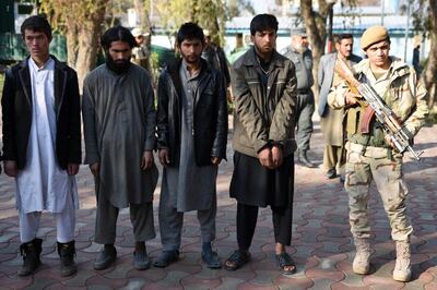 Members of the Afghan security services escort alleged members of ISIS and the Taliban, arrested during an operation in Nangarhar province, January 27, 2016. EPA