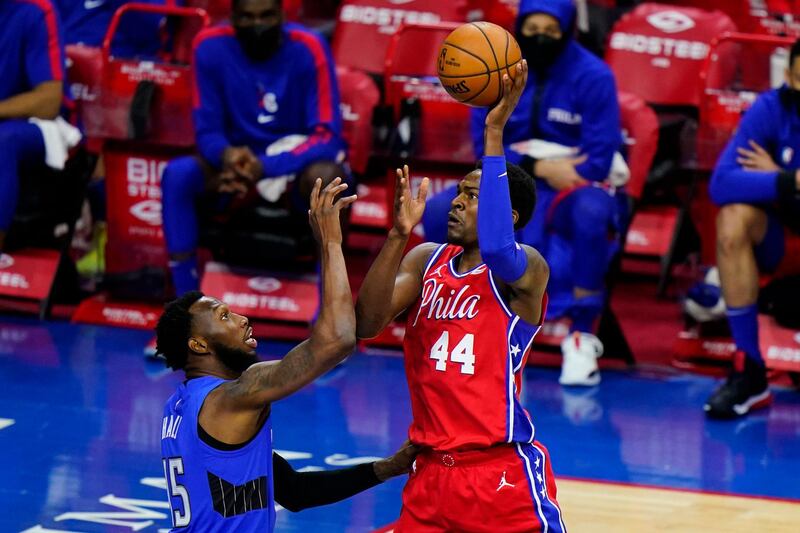 Philadelphia 76ers' Paul Reed, right, goes up for a shot against Orlando Magic's Donta Hall during the second half of an NBA basketball game, Friday, May 14, 2021, in Philadelphia. (AP Photo/Matt Slocum)