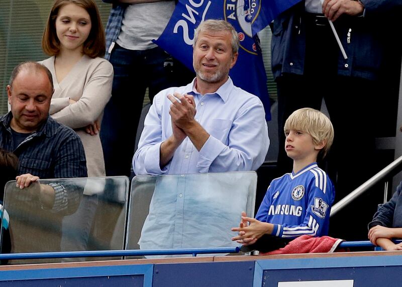 Roman Abramovich, centre, applauds after Chelsea were presented with the Premier League trophy at Stamford Bridge on May 24, 2015. AP