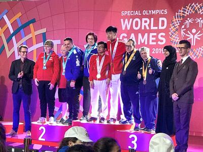 The National's assistant editor-in-chief Nick March presenting medals at the Special Olympics World Games / Courtesy Nick March