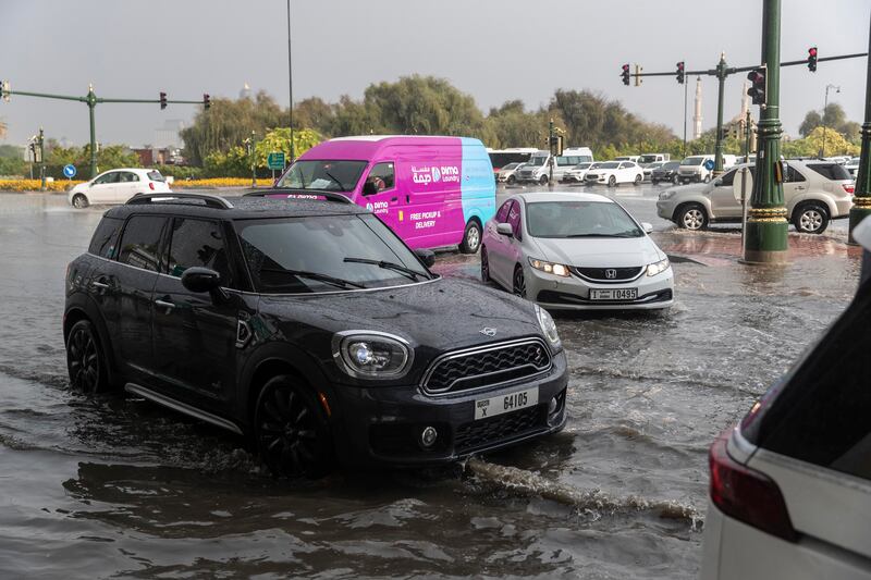 Cars struggle to make their way through rising waters in the World Trade Centre area.
