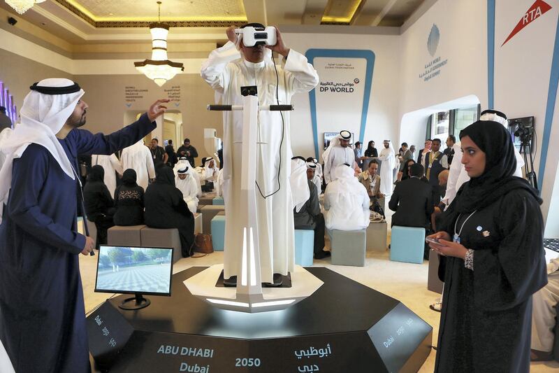 DUBAI , UNITED ARAB EMIRATES – Feb 13 , 2017 : Delegate watching the Virtual Reality show 2050 Abu Dhabi & Dubai in the World Government Summit 2017 held at Madinat Jumeirah in Dubai. ( Pawan Singh / The National ) For News. Story by Dana Moukhallati. ID No : 39010 *** Local Caption ***  PS1302- WGS17.jpg