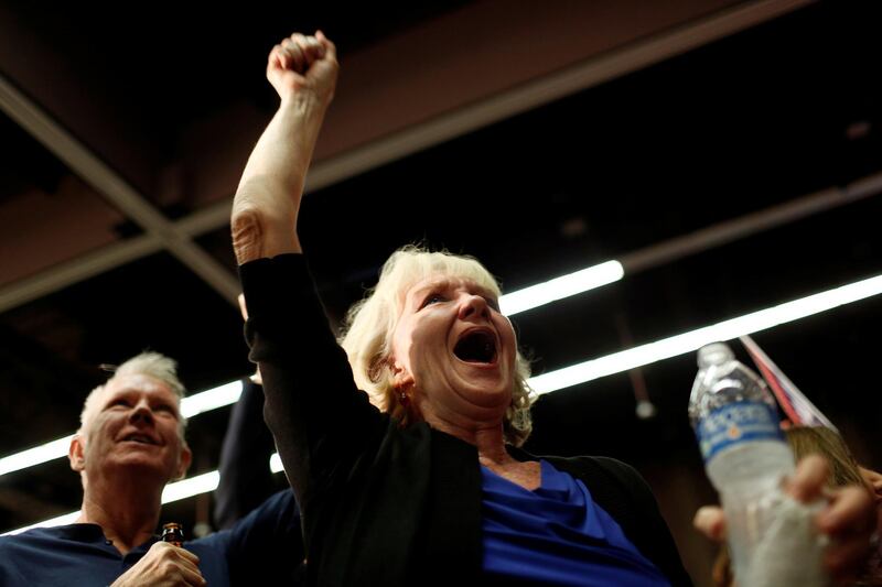Supporter Sharon Machold cheers as midterm elections results are announced at the GOP watch party in Arizona