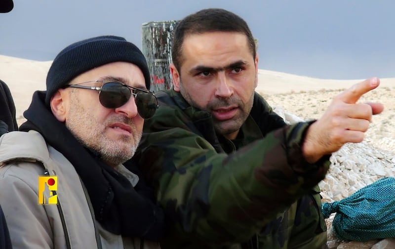 Mr Tawil, right, is pictured with senior Hezbollah commander Mustafa Badreddine, who was killed in Syria on May 2016