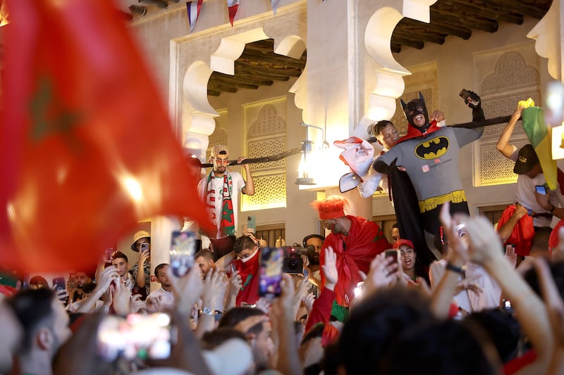 Moroccans celebrate a superhero performance in Souq Waqif, Doha. Getty Images