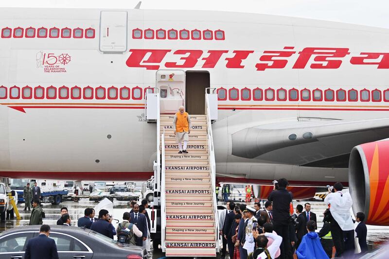 Indian Prime Minister Narendra Modi disembarks.  AFP