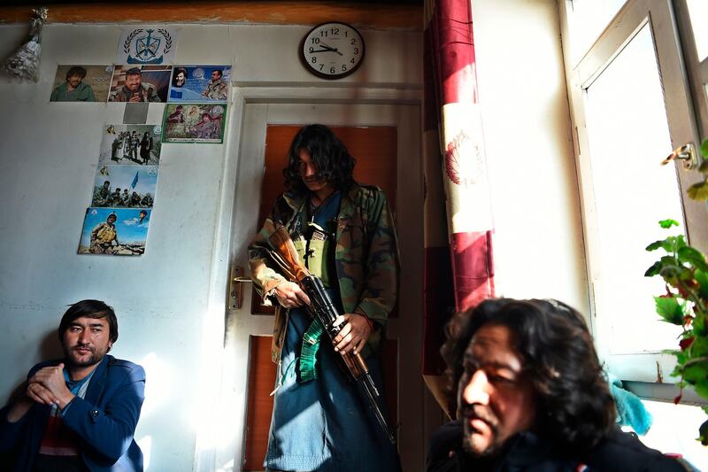 Hazara militia fighters stand inside their base ahead of a patrol against Taliban insurgents in Wardak Province, Afghanistan, on January 9, 2021. Comprising roughly 10 to 20 percent of Afghanistan's 38-million population, Hazaras have long been persecuted by the Taliban. AFP