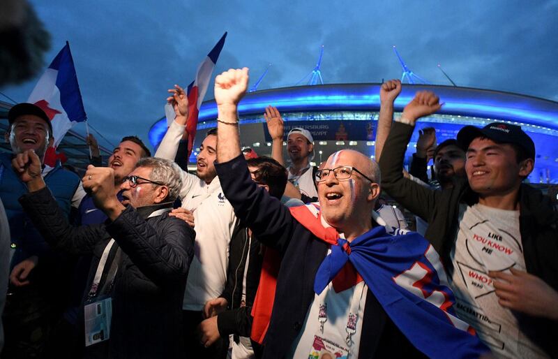 France's supporters celebrate France's 1-0 victory over Belgium during the semi-finals of Russia 2018 World Cup football tournament outside the Saint Petersburg Stadium on July 10, 2018. / AFP / OLGA MALTSEVA
