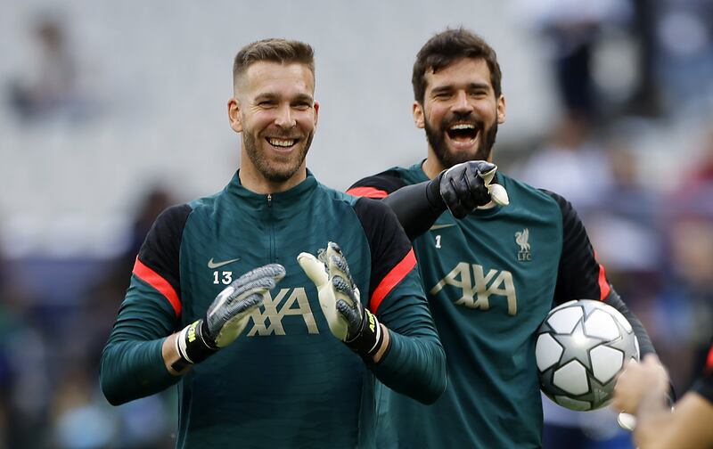 Liverpool goalkeepers Alisson Becker, right, and Adrian during training in Paris. EPA