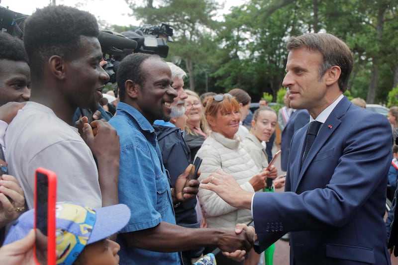 Mr Macron greets members of the public at Le Touquet. 