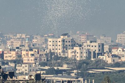 Leaflets are dropped by the Israeli military over Gaza city telling people to evacuate the area. AFP