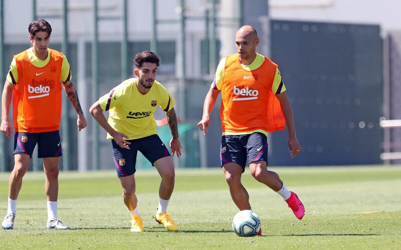 Martin Braithwaite controls the ball under pressure from Alex Collado (L) and Ramon Rodriguez 'Monchu' (C) during a training session at Ciutat Esportiva Joan Gamper. Getty Images