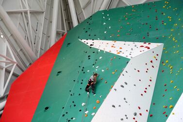 Climber Sasha DiGiulian scales the world's tallest indoor climbing wall at Clymb Abu Dhabi. Chris Whiteoak / The National