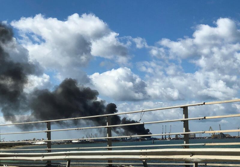 Smoke rises from a port of Tripoli after being attacked in Tripoli, Libya. REUTERS