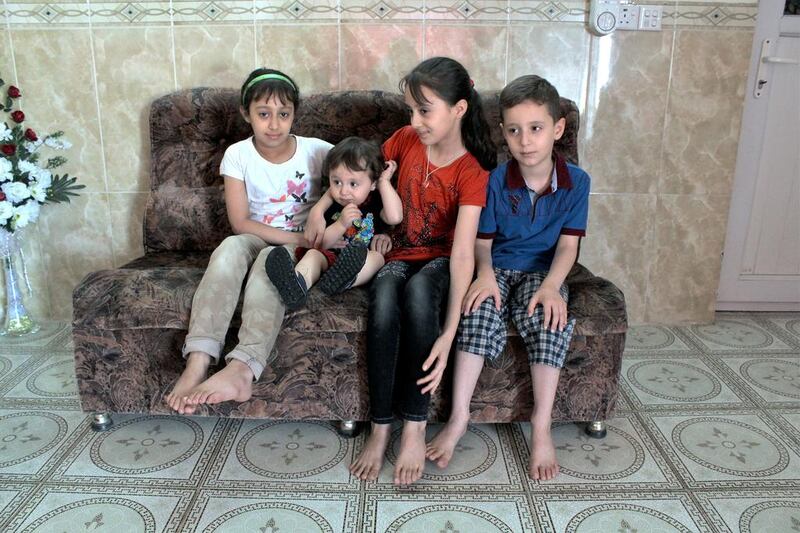Mohammed Jassem and his family fled Fallujah when ISIL captured the city in 2014. From left, his children Shaded, 11, Abdulrahmen, 18 months, Rahma, 10, and Mahmoud, 7 now live with him in the Kurdish resort town of Shaqlawa.  Florian Neuhof for The National 