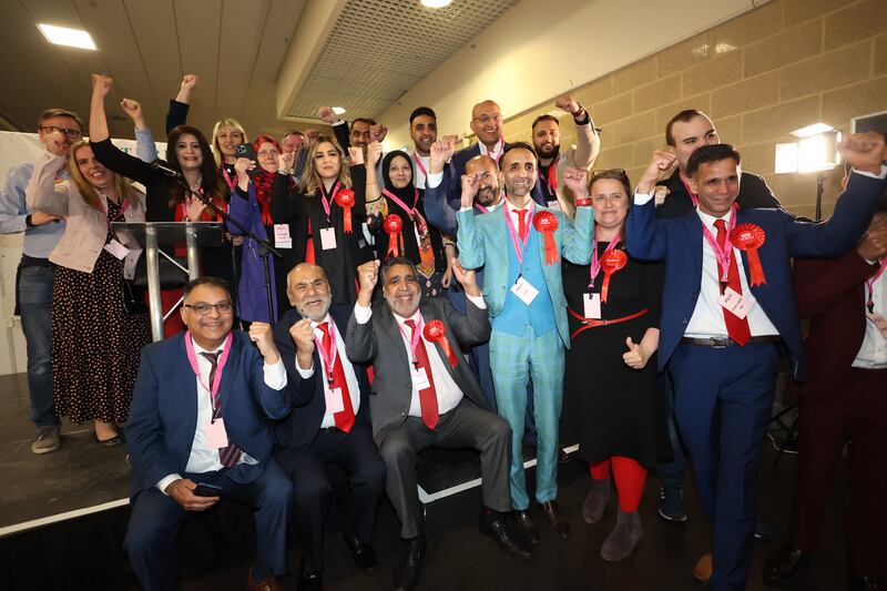 Labour candidates and supporters celebrate as the votes are counted at Peterborough Arena. PA