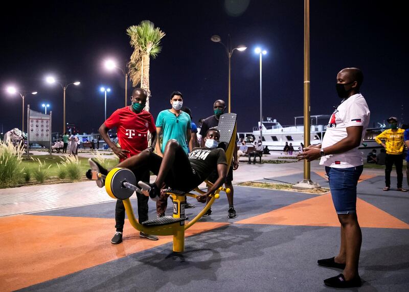 DUBAI, UNITED ARAB EMIRATES. 2 JUNE 2020. 
Men exercising in a park by Dubai Creek in Baniyas, Deira.
(Photo: Reem Mohammed/The National)

Reporter:
Section: