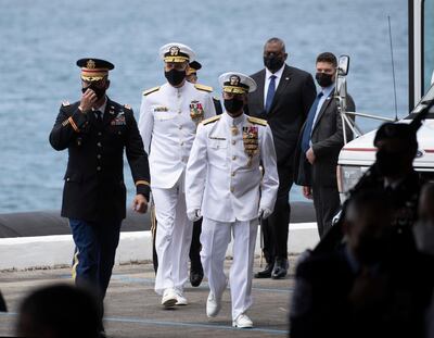 Adm. John C. Aquilino and Adm. Philip S. Davidson with Secretary of Defense Lloyd J. Austin arrive at at a Change of Command ceremony for the U.S Indo-Pacific Command, Friday, April 30, 2021  at  Joint Base Pearl Harbor-Hickam west of Honolulu. In his first major speech as Pentagon chief, Lloyd Austin on Friday called for developing a â€œnew visionâ€ for American defense in the face of emerging cyber and space threats and the prospect of fighting bigger wars. (Cindy Ellen Russell/Honolulu Star-Advertiser via AP)