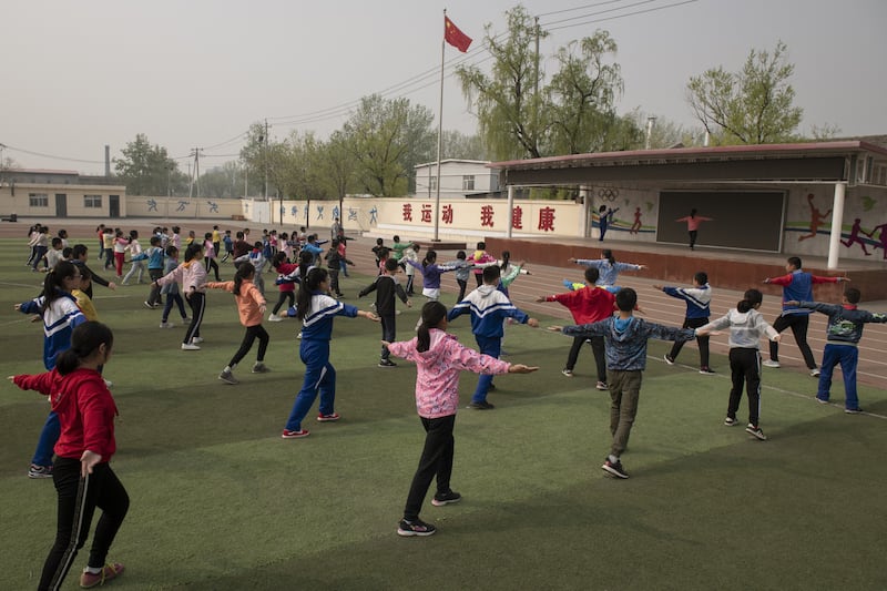 Pupils do their morning exercise at a school on the outskirts of Beijing, China. AFP