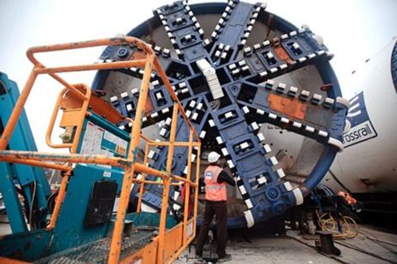 An engineer inspects the cutterhead of a tunnel boring machine (TBM) at Crossrail's Westbourne Park portal in London, U.K., on Wednesday, Feb. 29, 2012. The U.K. government has asked four bidders to submit proposals to supply about 60 new trains and build a depot in west London for the city's Crossrail project. Photographer: Jason Alden/Bloomberg