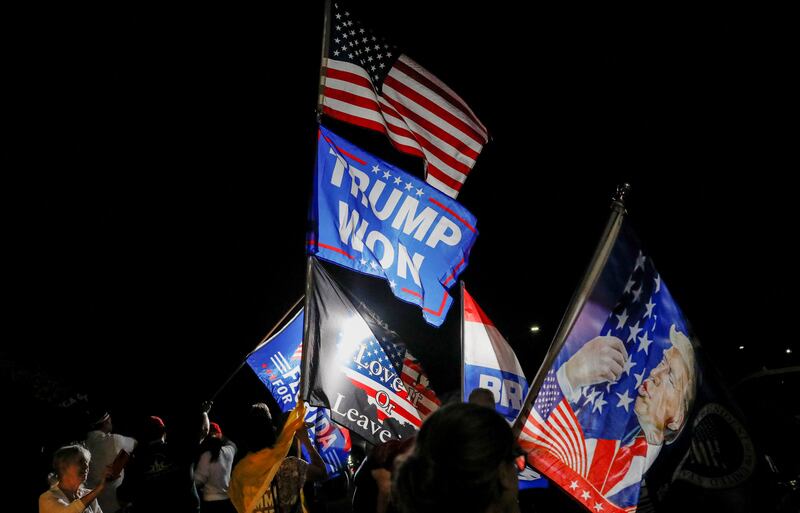 Trump supporters in Palm Beach, Florida outside Mar-a-Lago on Monday night. Reuters
