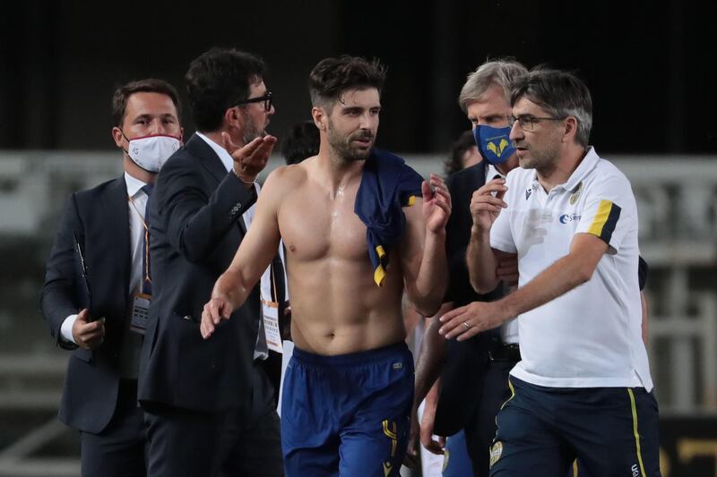 Verona's head coach Ivan Juric and midfielder Miguel Veloso celebrate victory at the end of the match. EPA
