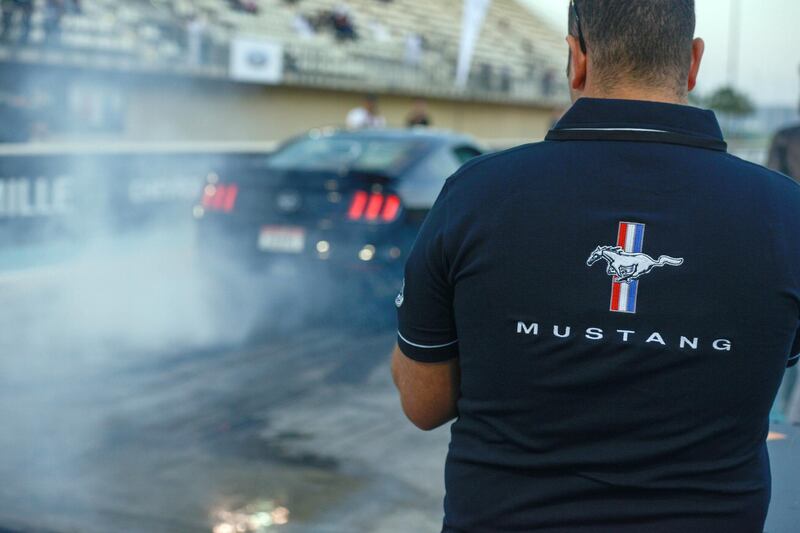 Abu Dhabi, United Arab Emirates - Mustangs burn out at the Drag Race Car Show event sponsored by Premium Motors & organized by Emirates Mustang Club at Yas Marina Circuit on January 29, 2018. (Khushnum Bhandari/ The National)
