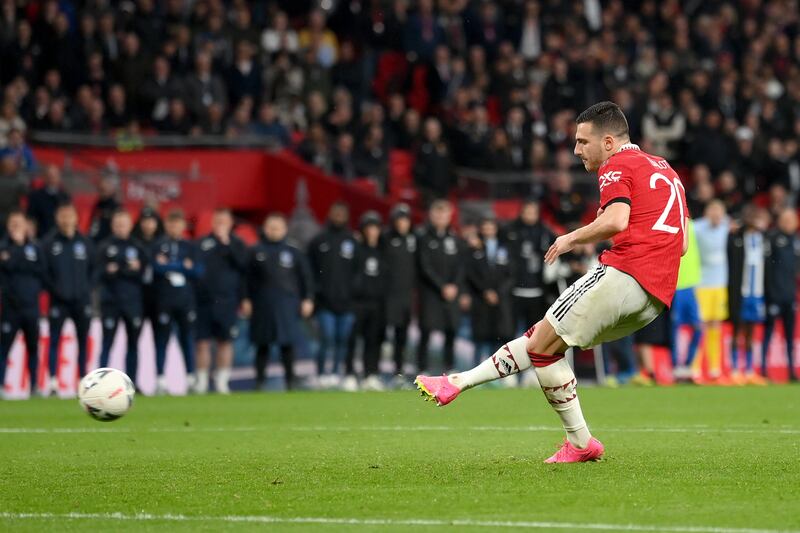 Diogo Dalot of Manchester United scores the team's second penalty in the shootout. Getty