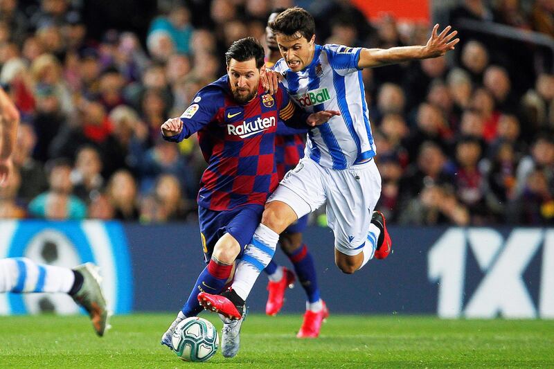 Lionel Messi in action against Real Sociedad's Ander Guevara.  EPA