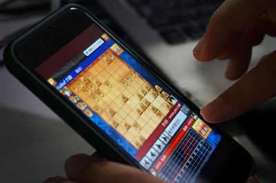 Heroz Inc.'s Shogi Wars game is displayed on a smartphone at the company's headquarters in an arranged photograph taken in Tokyo, Japan, on Thursday, June 28, 2018. In April, Heroz listed on a startup market on the Tokyo Stock Exchange. The shares opened 11 times higher than the IPO price, the best ever start of trading by a Japanese listed company. Photographer: Kentaro Takahashi/Bloomberg