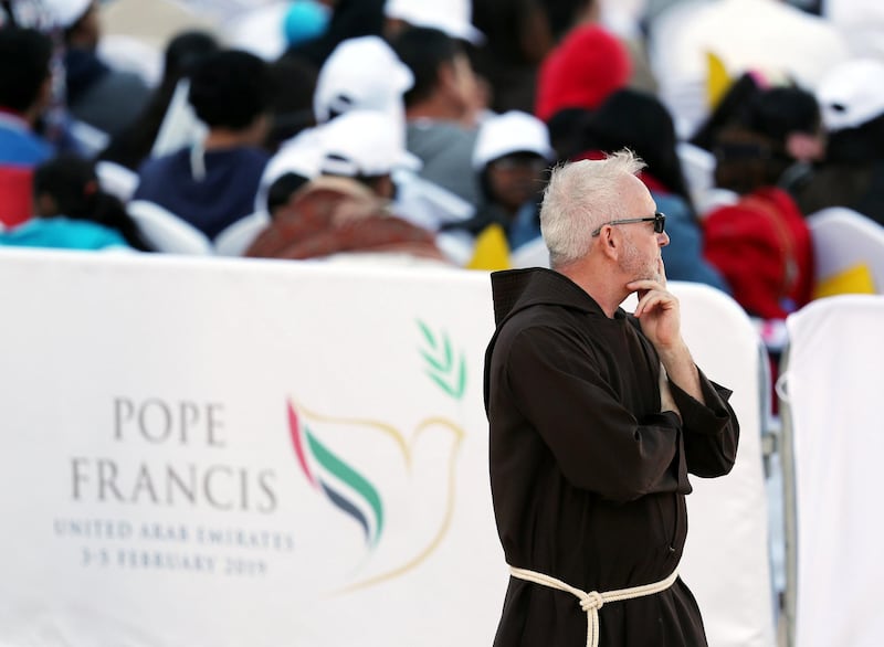 Abu Dhabi, United Arab Emirates - February 05, 2019: People get ready for the mass. Pope Francis takes a large public mass to mark his land mark visit to the UAE. Tuesday the 5th of February 2019 at Zayed Sports city stadium, Abu Dhabi. Chris Whiteoak / The National