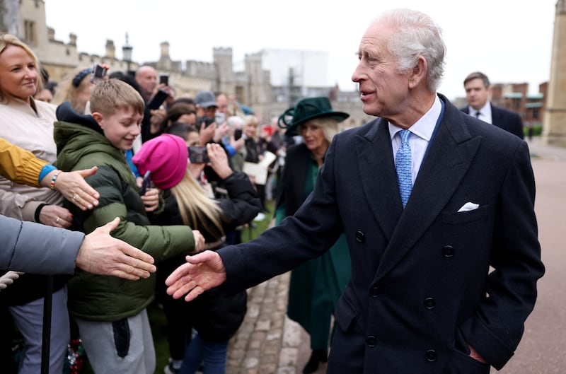 King Charles III and Queen Consort Camilla greet people after attending the Easter Mattins Service at Windsor Castle in Windsor, England. Getty Images
