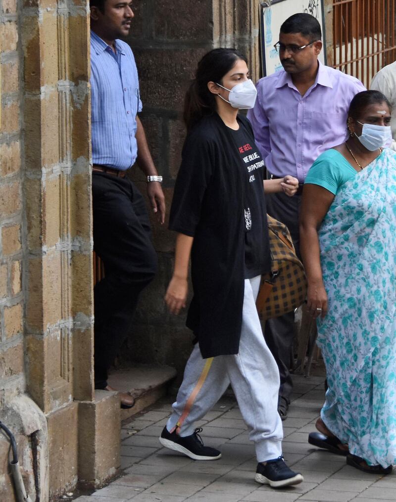 Bollywood actor Rhea Chakraborty walks out of the Narcotics Control Bureau (NCB) office to be taken for a medical check, in Mumbai, India, Tuesday, Sept. 8, 2020. The Bollywood actress who was arrested by India's narcotics agency, setting off a media frenzy that has gripped the nation, walked out of jail on Wednesday, Oct. 7, after being granted bail. Chakraborty was released from Bycula District Prison in Mumbai a month after being arrested for allegedly buying drugs for her boyfriend, popular movie actor Sushant Singh Rajput, who was found dead in a suspected suicide in June. (AP Photo/Bhushan Koyande)