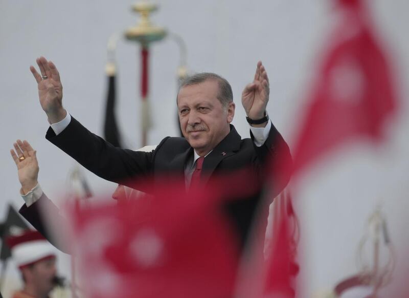 Turkey's President Recep Tayyip Erdogan waves to the crowds in Istanbul during an election rally (AP Photo/Lefteris Pitarakis)