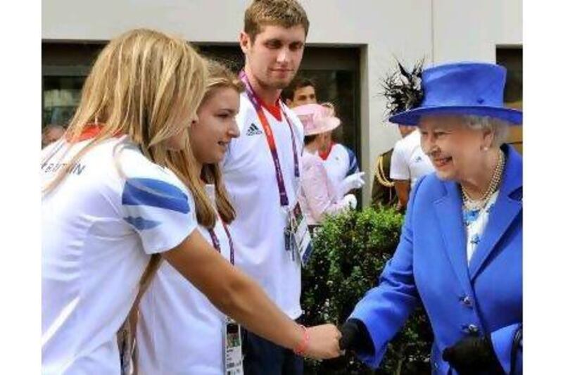 Queen Elizabeth, pictured meeting Olympic athletes, does a lot of good work, a reader says. John Stilwell / AFP