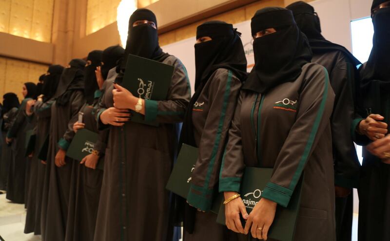 Saudi women hold their diplomas during the graduation ceremony of Saudi women car-accident inspectors, a few days before women are set to take the wheel in Riyadh, Saudi Arabia June 21, 2018. Picture taken June 21, 2018. REUTERS/Noemie Olive