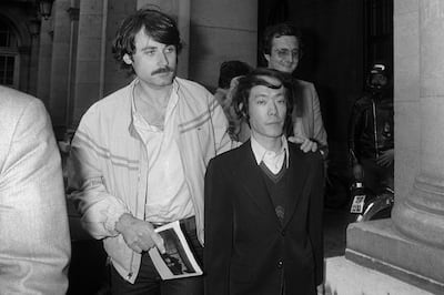 Issei Sagawa leaves Paris police headquarters after questioning in 1981.  AFP 