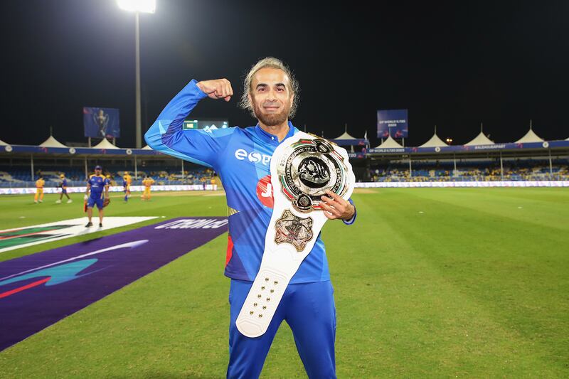 Imran Tahir of MI Emirates holds his belt for best bowler