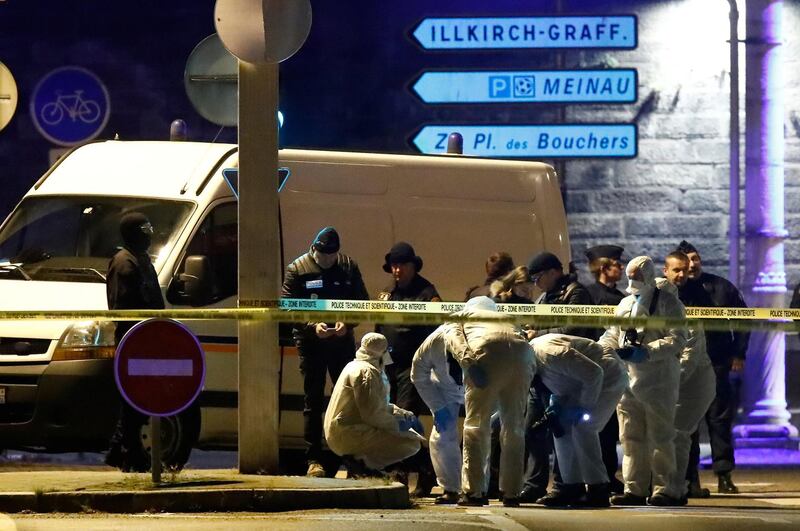 Investigators work on the street during a police operation during which the suspected gunman, Cherif Chekatt was killed. Reuters