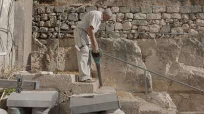 The film contains many long moments of the town's residents cleaning their homes and doing housework. Photo: Reel Palestine