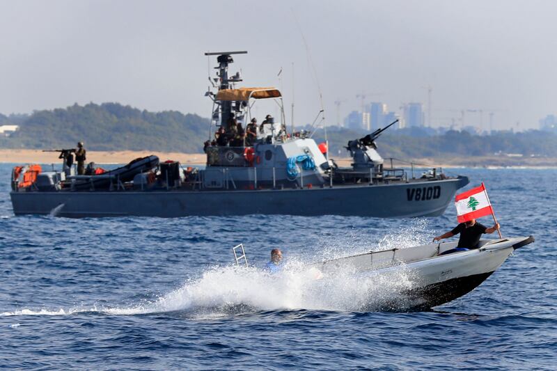 Lebanese protesters on a motorboat sail in front of an Israeli navy vessel during a demonstration on September 4. AP Photo